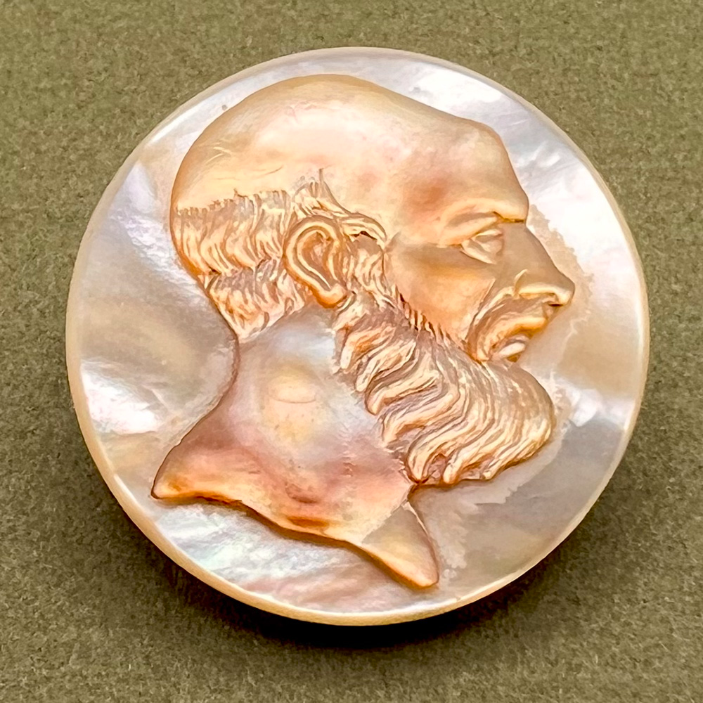 Unusual Cameo carved iridescent pearl button of bearded man.