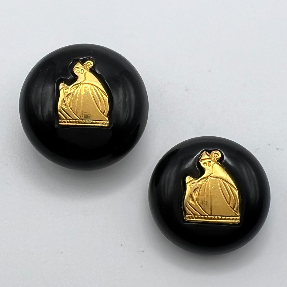 Two Casein buttons with impressed brass logo of Jeanne Lanvin.
