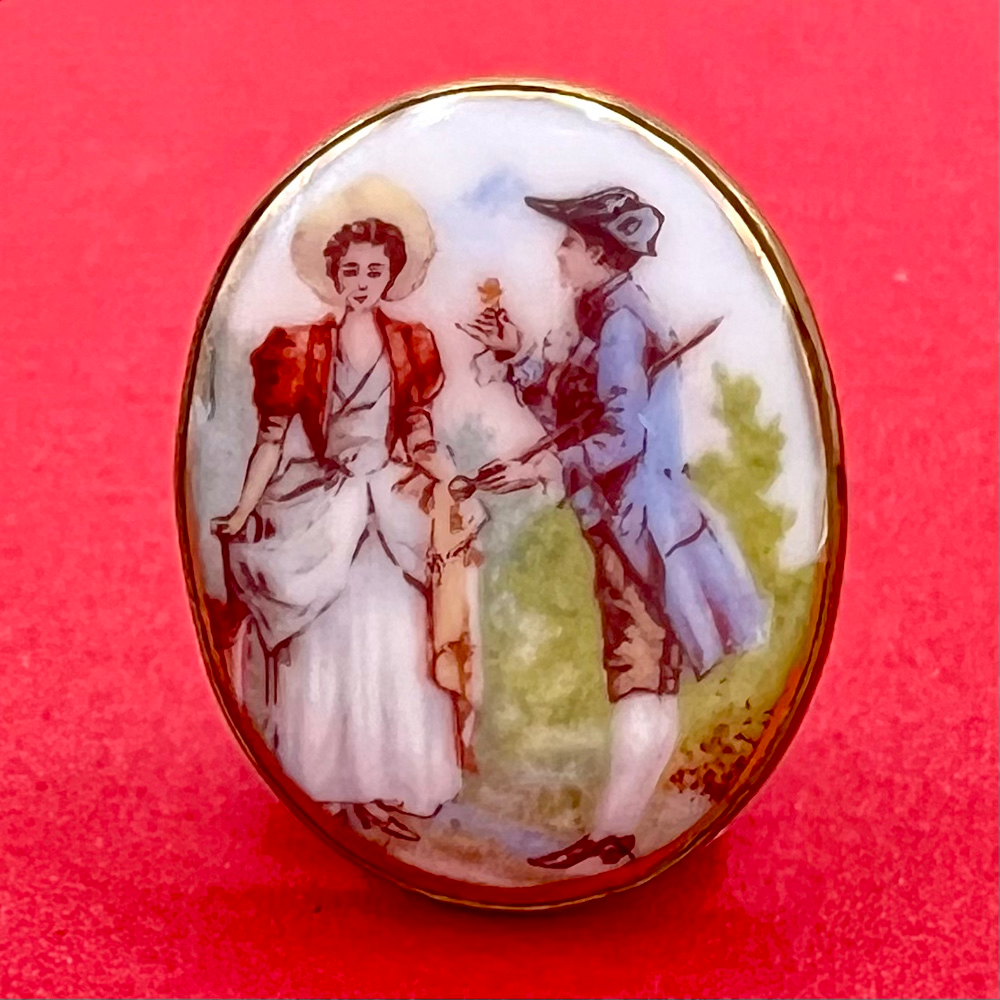 Transfer on porcelain button of a courting couple.