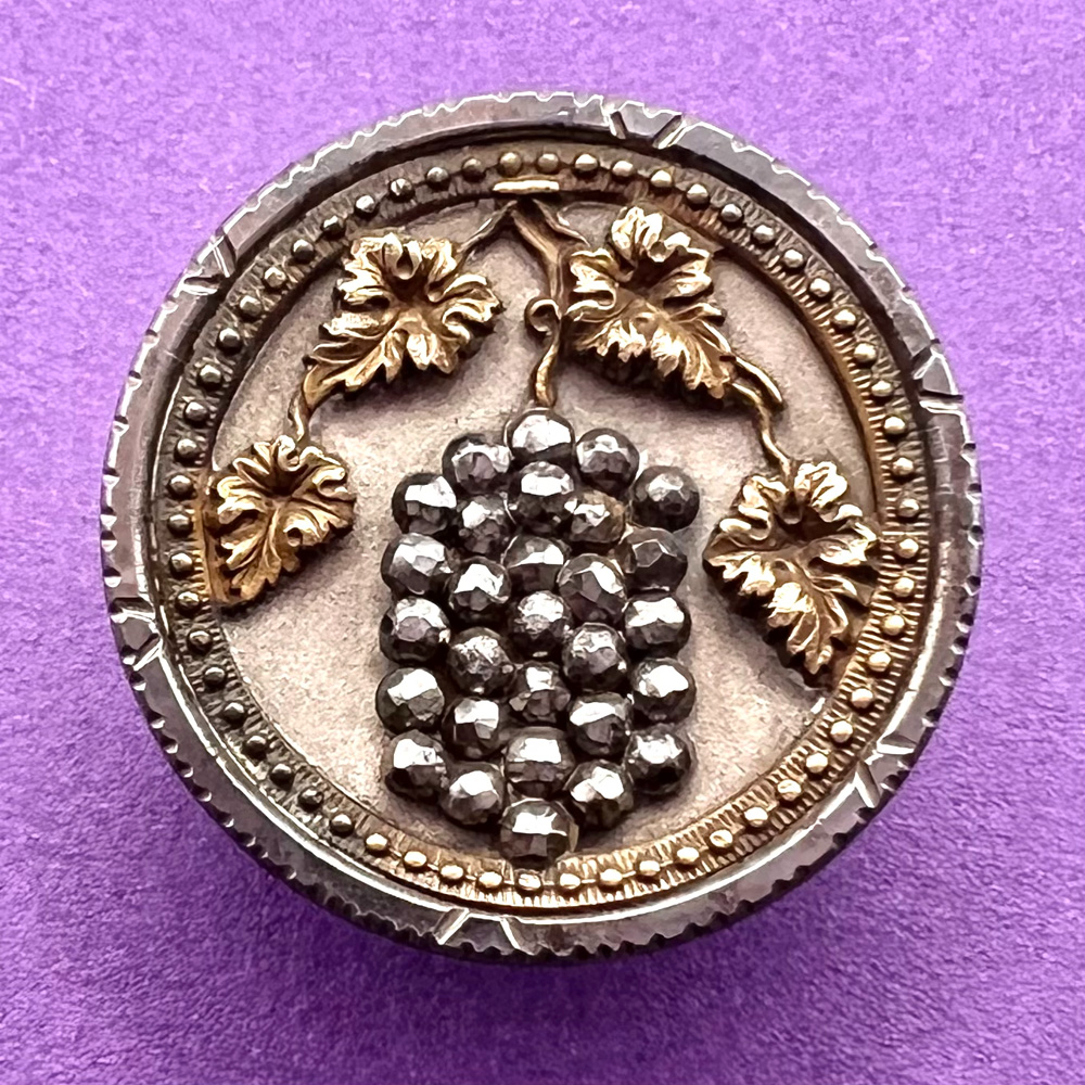 Grapes on the vine steel cup button.