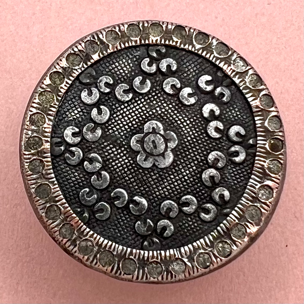 An 18th c. French Repoussé button of a floral pattern.