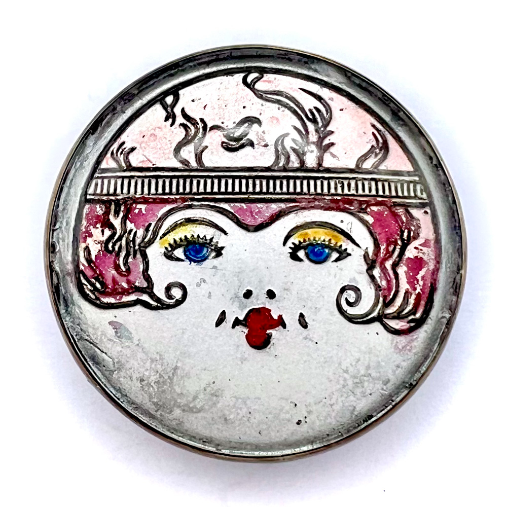 Vintage “flapper” glass in metal button.