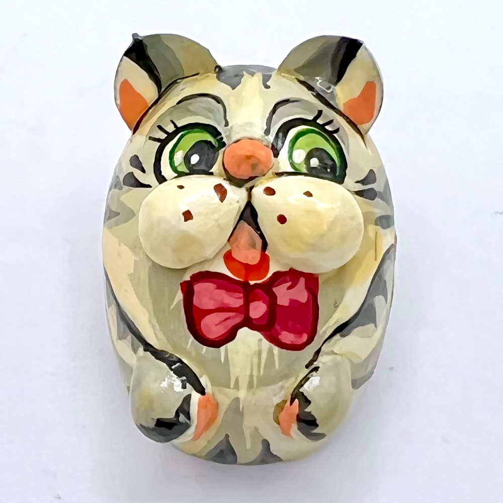 Russian Lacquer cat or mouse wearing a bow tie button.