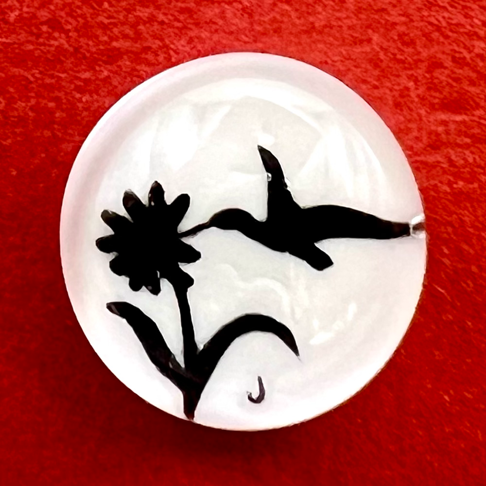 Studio glass paperweight button of hummingbird by John Gooderham.