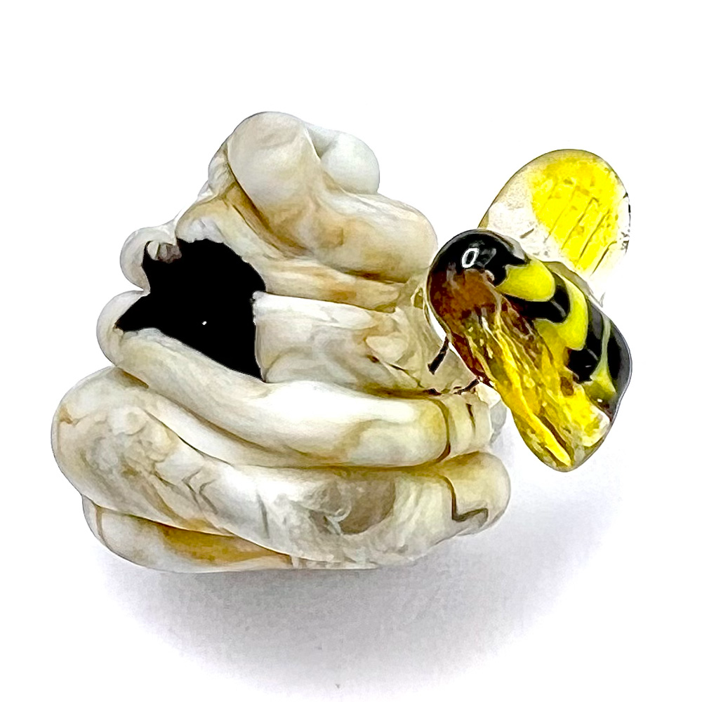 Mary Gaumond’s bee and hive studio glass button.