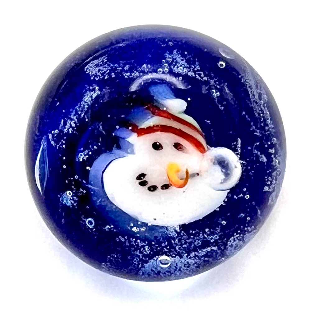 Mary Gaumond’s snowman face studio glass paperweight button.