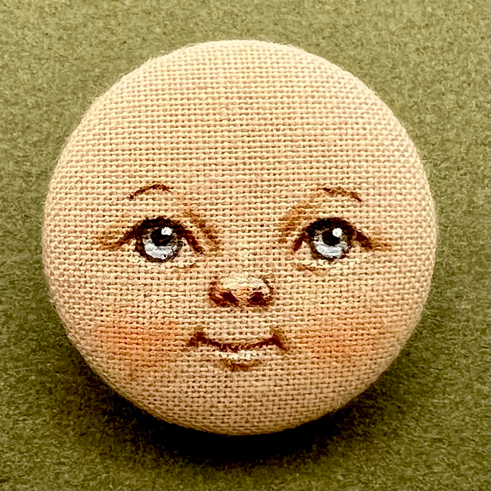 “Baby face” hand painted silk studio button by Susan Fosnot.