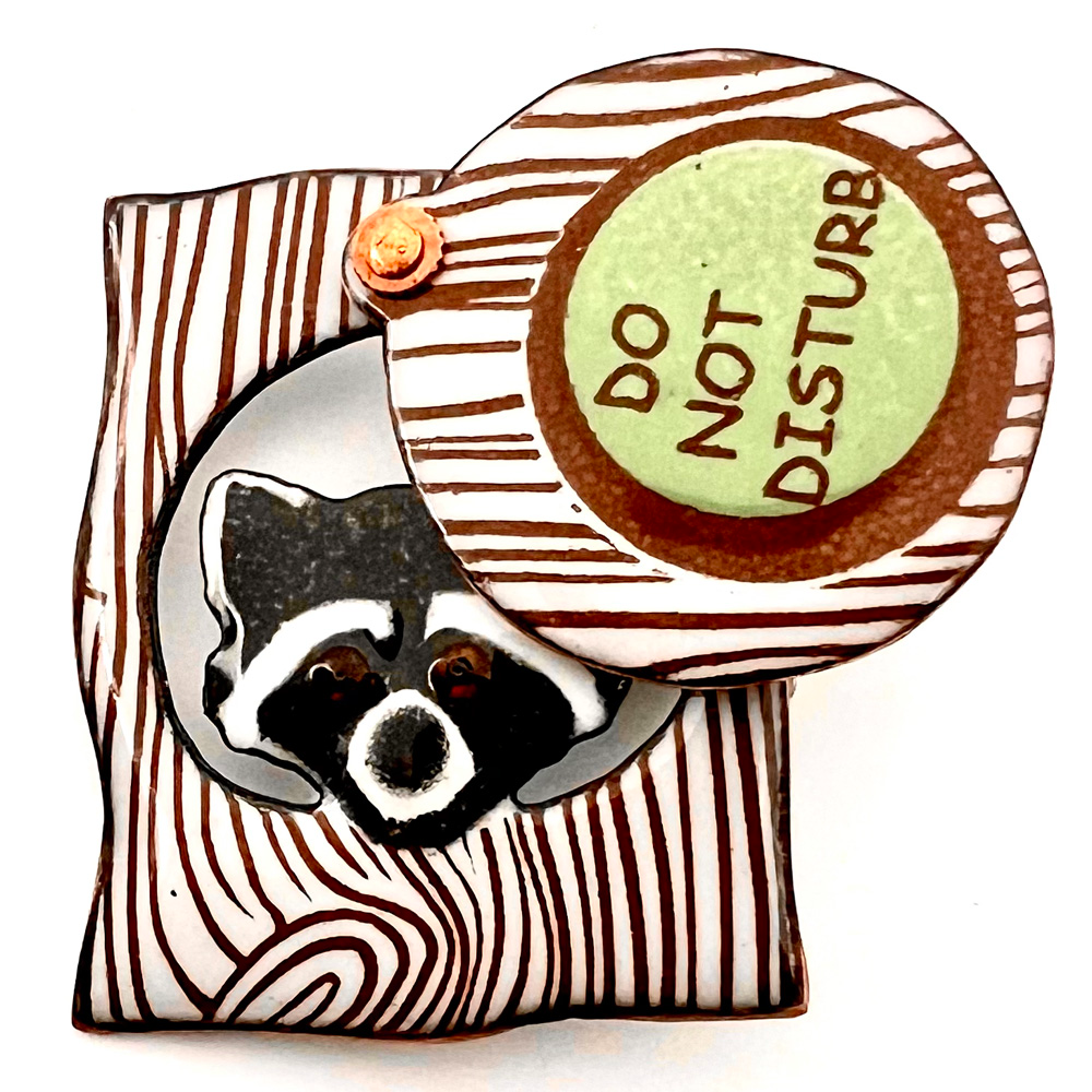 “Raccoon” enamel movable studio button by Janet White.