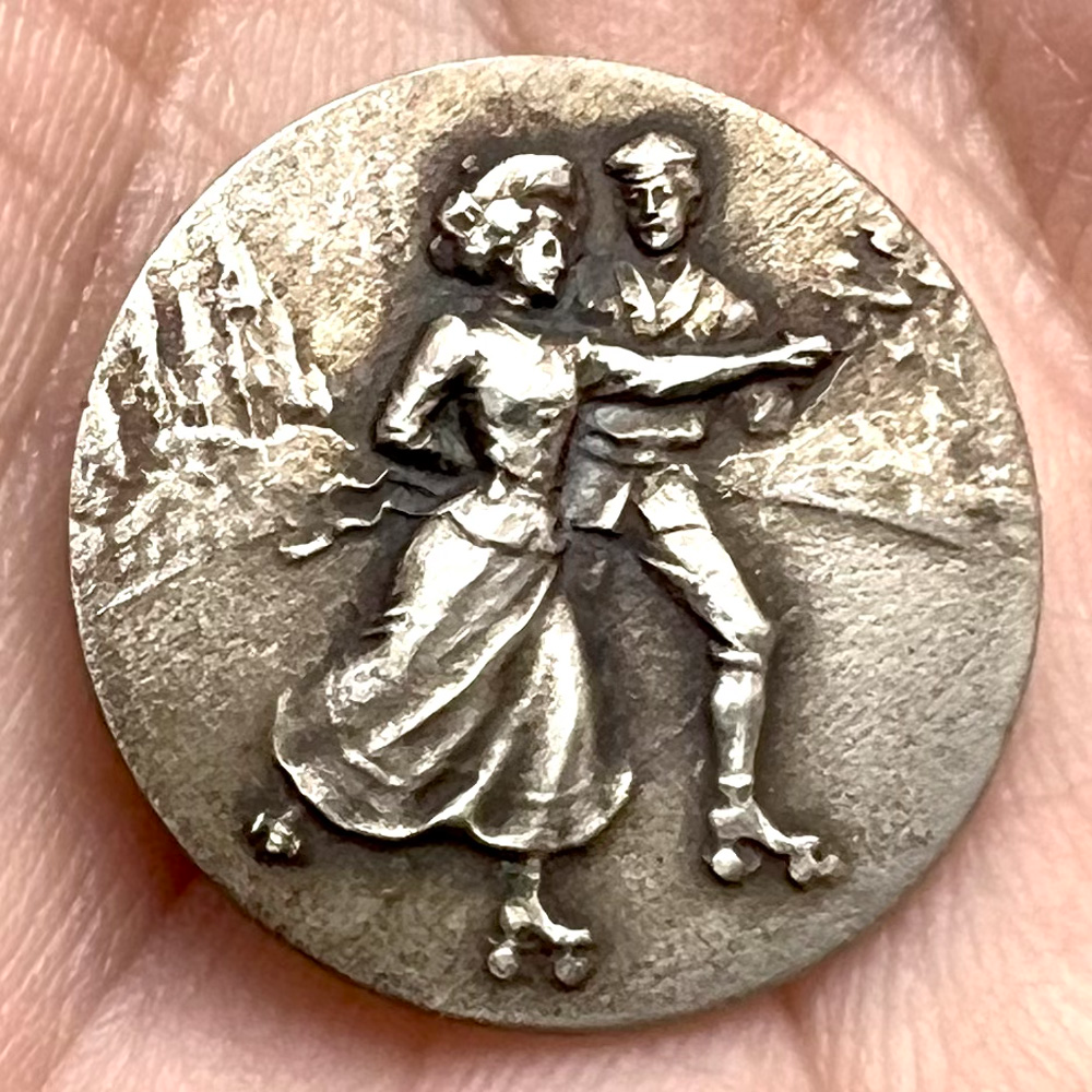 Highly Collectible 3rd Avenue Silver button of “Skaters.”