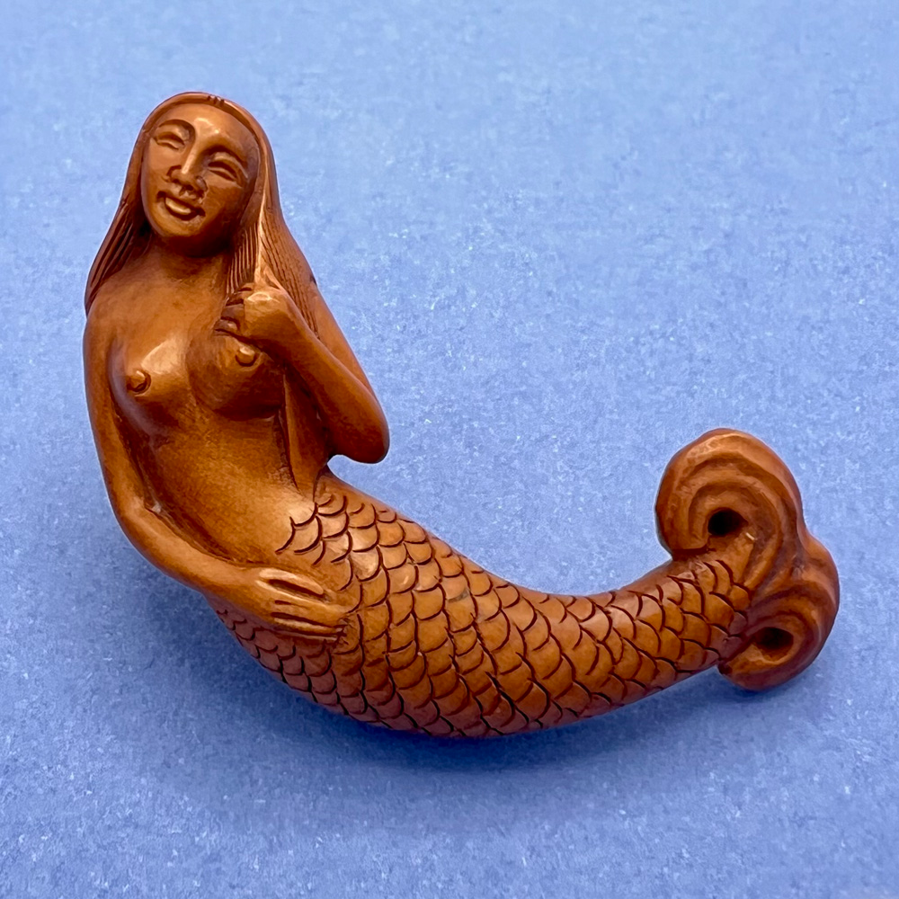 Extra-large boxwood realistic mermaid button.