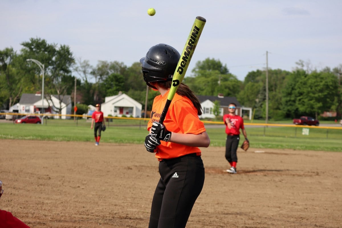 Girl playing softball