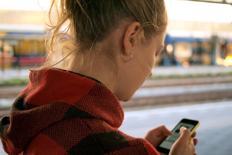 woman looking at phone screen