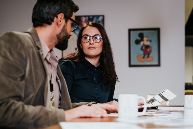 Man and woman sitting and talking