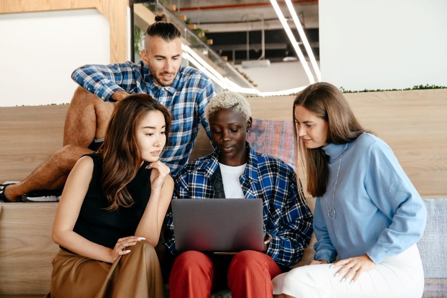 Nonprofit team researching at computer