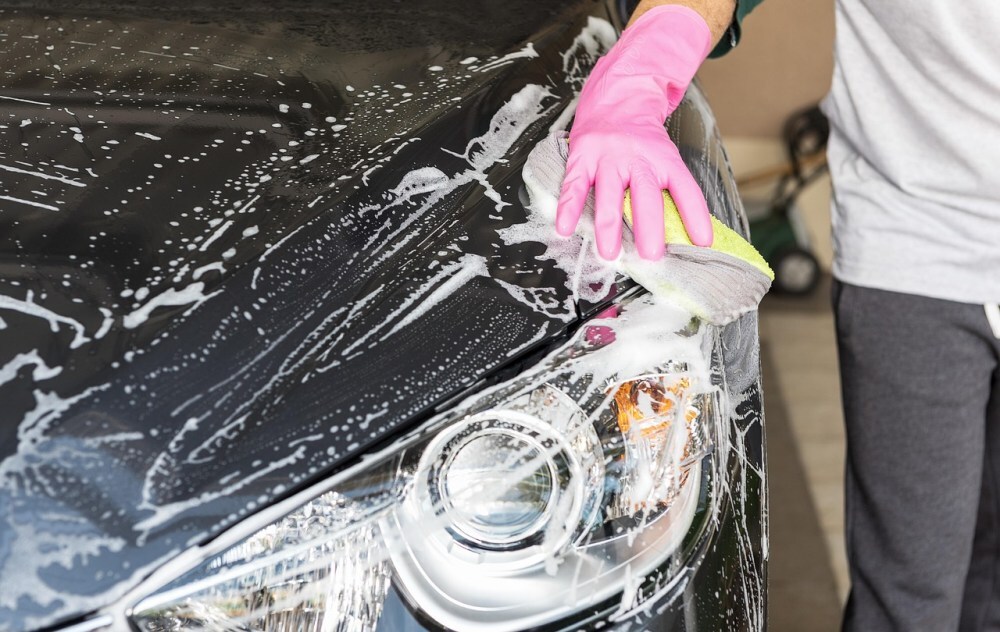 Person washing a car