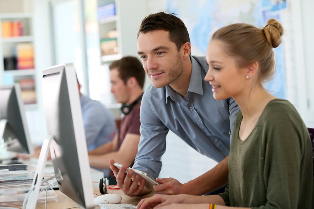man looking at computer screen