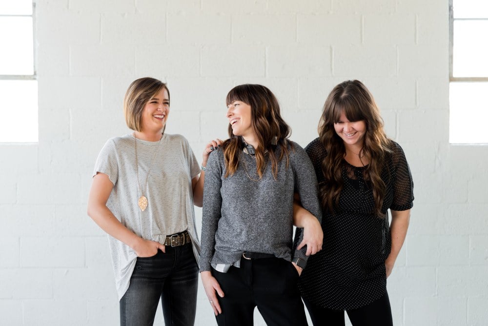 Three women standing and talking