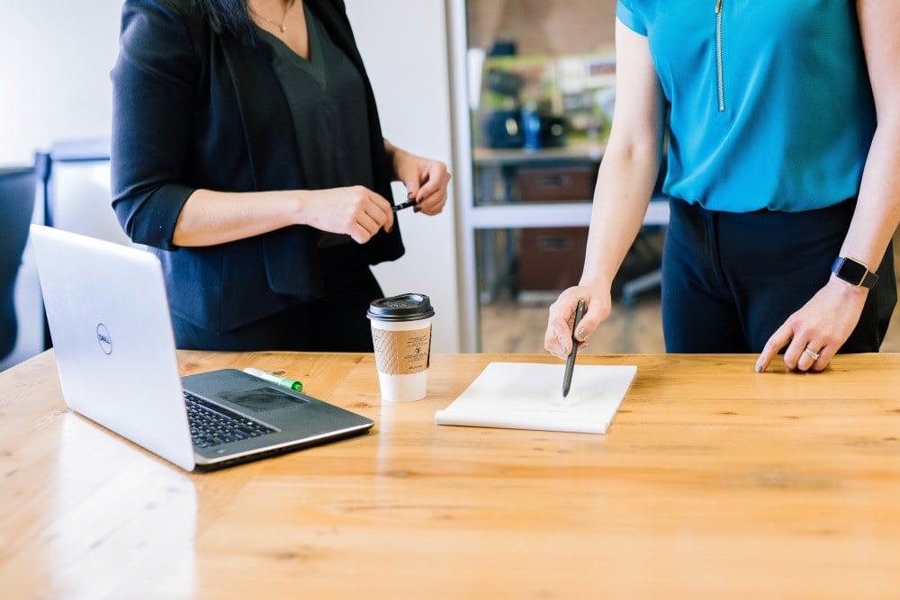 Two women putting together a fundraiser strategy