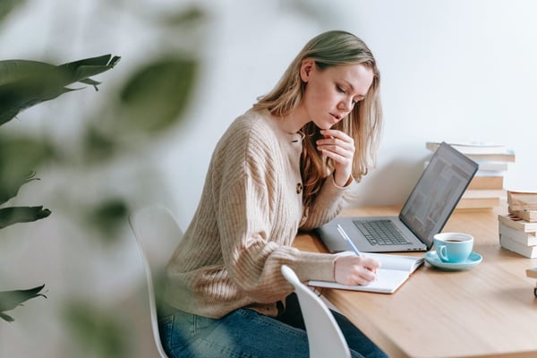Woman doing prospect research on computer
