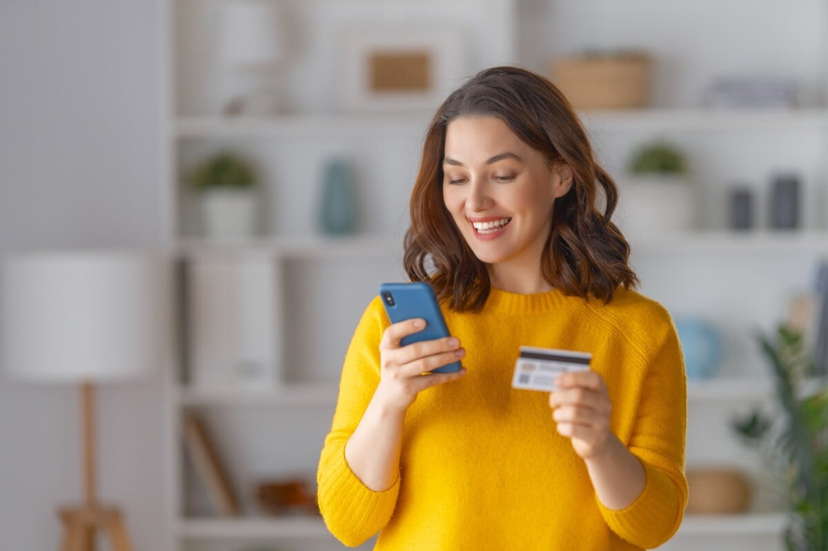 Woman making an easy payment on her mobile phone