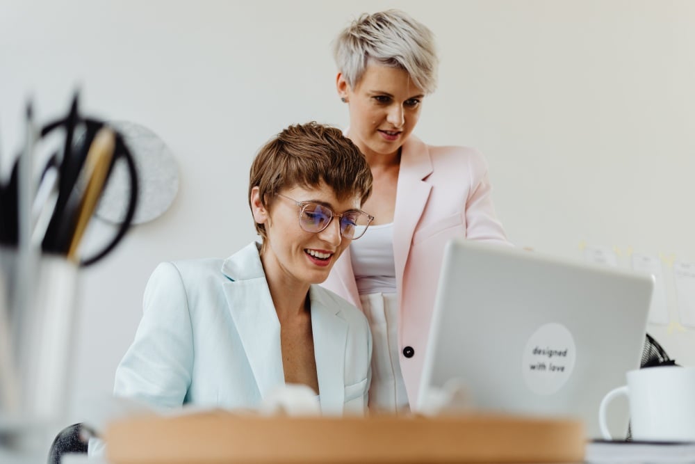 Women typing up a letter on a laptop