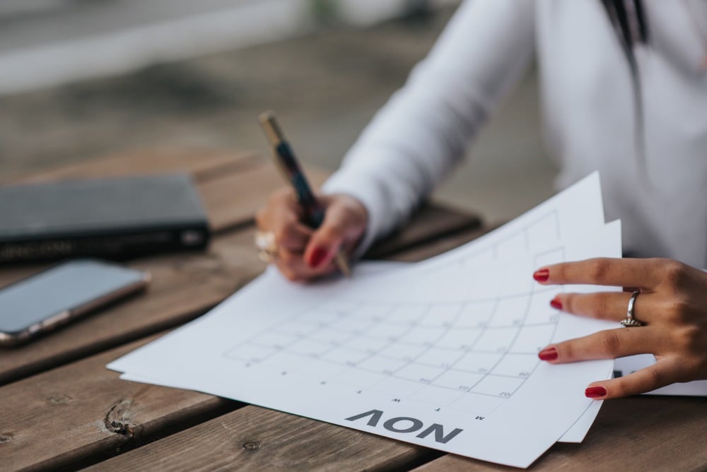 woman putting together a fundraising calendar