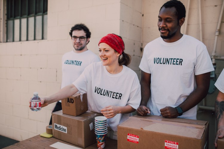 Volunteers handing out donations