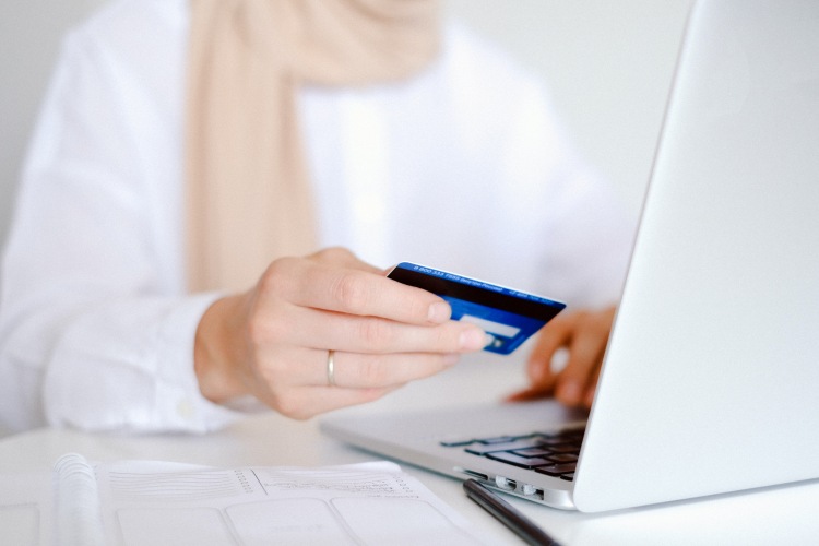 Woman making payment on laptop